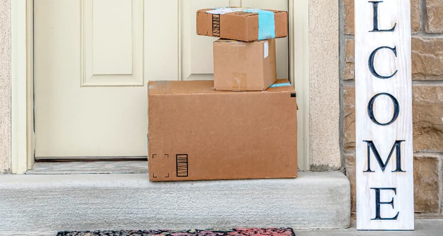 Boxes by the door of a residence with a welcome sign in Youngstown